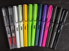 A group of 13 Lamy (Germany) fountain pens in various colours.