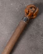 An Edwardian Bull's pizzle walking cane: with knotted pommel and silver ferrule, Birmingham 1902,