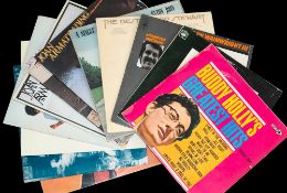 A group of thirteen vinyl albums by singers, songwriters, etc.