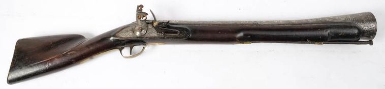 A 19th century Indian flintlock blunderbuss: the 20 inch steel barrel with flared muzzle and