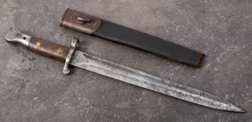 An 1888 pattern Lee Metford bayonet: the straight double edge blade stamped with crown,