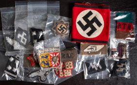 A collection of military cloth insignia, mostly German: including a NSDAP armband,