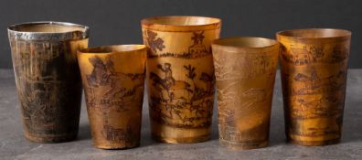 A group of five 19th century horn hunting cups: all with incised decoration,