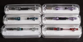 A group of six TWSBI (Taiwan) Diamond 580AL Piston filing fountain pens: in blue, purple, rose,