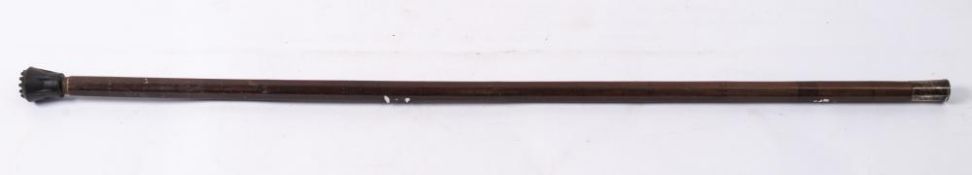 A 17th century white metal mounted octagonal hardwood walking cane: the pommel with engraved