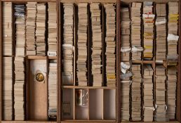 An accumulation of loose cigarette cards, Odgens, Players and others: in three wooden trays.