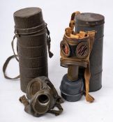 A WWII period German gas mask in container: the base stamped 'S.A.F.