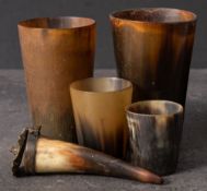 A group of four 19th century horn beakers: all of plain design,