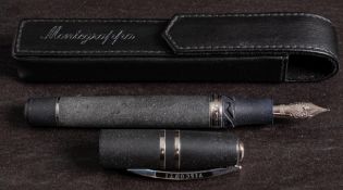 A Visconti 'Homo Sapiens' basaltic lava fountain pen with silver nib and mounts: in an associated