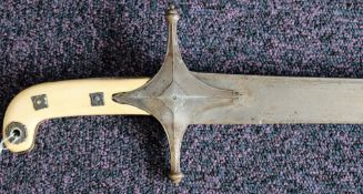 An Indian ivory handled shamishir: the slightly curved single edge blade over a star shaped hilt