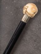 A late Victorian/Edwardian erotic walking cane: the ivory pommel carved in the form of a female
