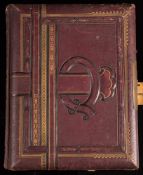 An Edwardian Musical Cabinet photograph album: with floral lithographed pages and part filled with