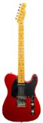 A Fender (Japan) Telecaster: maple neck with dot fret markers,