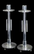 A pair of 20th Century chrome candlesticks: with cylindrical nozzles and circular sconces,