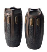 A pair of Bretby 'Clanta' pottery vases: of moulded and vertically ribbed oviform decorated with