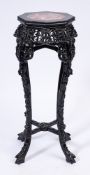 A Chinese carved hardwood octagonal jardiniere stand:,