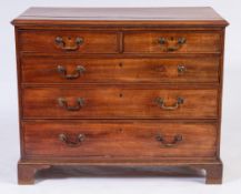 A George III mahogany rectangular chest:, the top with a moulded edge,