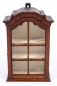 An early 19th Century oak wall mounted domed display cabinet:,