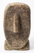 A carved hardstone head in the cycladic style: 27cm high.