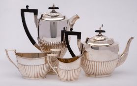 An electro-plated four-piece tea and coffee service: of oval outline, with half reeded decoration,