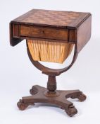 A William IV rosewood drop flap games and work table:, the hinged top with rounded corners,