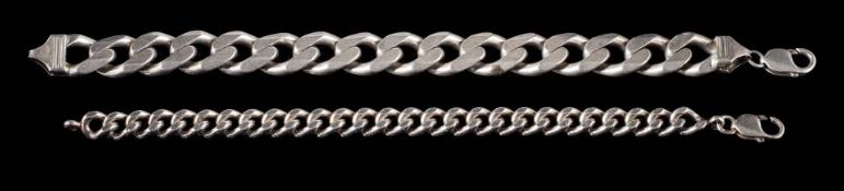 A large silver curb-link bracelet together with a smaller,