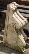A set of three Indian sandstone balcony supports: each carved with scrollwork and foliage,