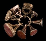 A collection of eight mostly gold filled seals: to include cornelian, amethyst and bloodstone.