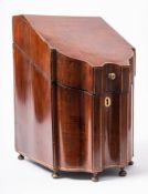 A George II mahogany and satinwood strung knife box: of double serpentine fronted outline,