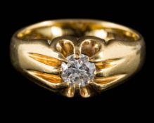 A gentleman's 18ct gold and diamond set single-stone ring: the claw-set,