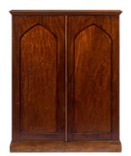 A collector's Victorian mahogany upright cabinet:, with a moulded top,