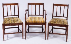 A set of seven early 19th Century mahogany dining chairs:,