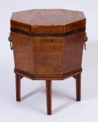 A Regency mahogany, inlaid and brass bound octagonal cellarette:,