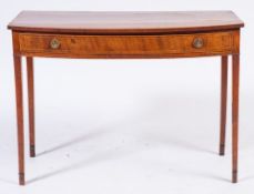 A George III mahogany and inlaid bow-fronted side table:, bordered with boxwood lines,
