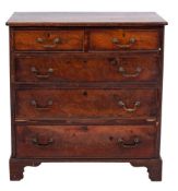 A George III mahogany rectangular chest:, the top with a moulded edge and re-entrant corners,