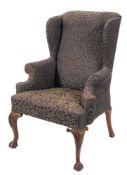 A carved beechwood wing frame armchair in the Georgian taste:,