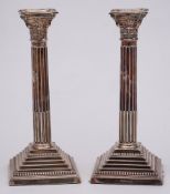 A pair of Elizabeth II silver Corinthian column candlesticks, maker A Chick & Sons Ltd, London,
