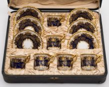 A Coalport porcelain demitasse coffee set: comprising six cups and six saucers decorated with
