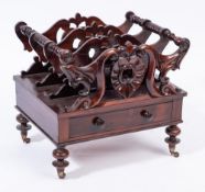 A Victorian carved rosewood three division Canterbury:,