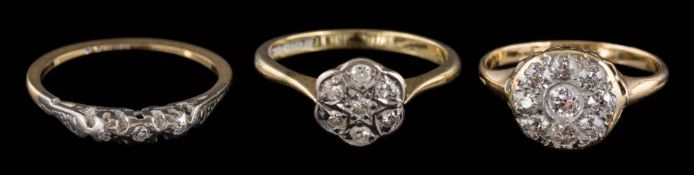 A diamond mounted circular cluster ring: with round brilliant-cut diamonds estimated to weigh a