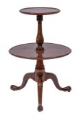 A mahogany circular two tier dumb waiter in the Georgian taste:,