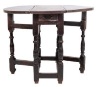 An early 18th Century oak gateleg table:, with an almost circular hinged top,