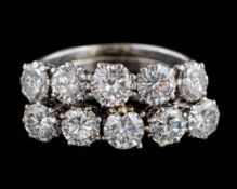 A diamond mounted ten-stone, two row cluster ring: set with ten round, brilliant-cut diamonds,