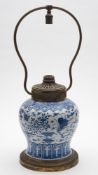 A Chinese blue and white baluster jar [as a lamp]: painted overall with butterflies and birds