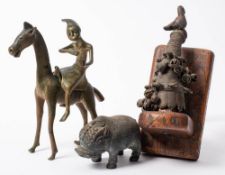 A Benin bronze model of a horse with mounted rider: 19cm high,