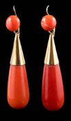 A pair of coral mounted drop earrings: each with a single coral bead suspending a drop,