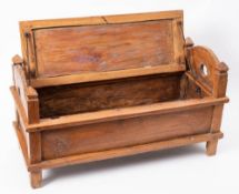 A South-East Asian polished hardwood bridal chest: of rectangular outline, with hinged panelled lid,