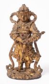 A Chinese gilt bronze and jewelled warrior figure: in traditional costume,