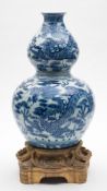 A Chinese ormolu-mounted blue and white double gourd 'dragon' vase: painted with dragons amongst