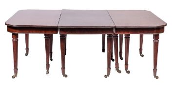 A good Regency mahogany dining table in the manner of Gillows:, comprising two D-end sections,